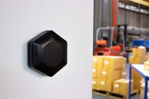 CamdenBoss Black Hex-Box IoT Enclosure Wall Mounted to Warehouse Wall